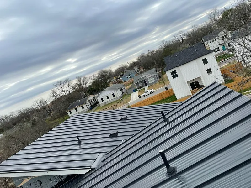 Standing seam metal roof panels with vents for Skylight Repair in Minnetrista